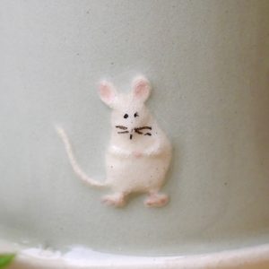 Jane Hogben Pottery Green Mug featuring a little mouse design