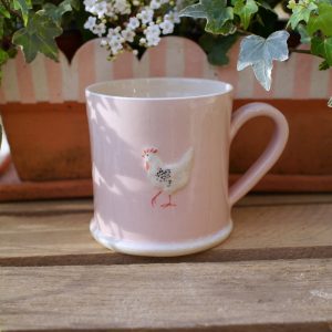 Lovely Jane Hogben Pottery Mug in Soft Pink featuring the Chicken design.